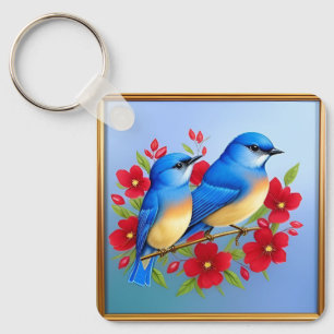 Kleurrijke ijsvogels zitten tussen rode bloemen sleutelhanger
