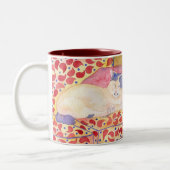 Kleurrijke kat op de mok van de sofa (Links)