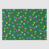 Kleurrijke kerstverlichting op groen tissuepapier (Voorkant)