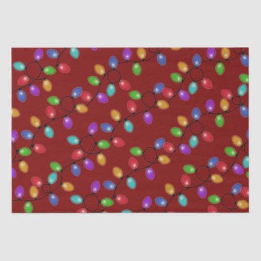 Kleurrijke kerstverlichting op rood tissuepapier (Voorkant)