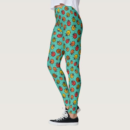Kleurrijke ladybugs op turkooizen leggings (Links)
