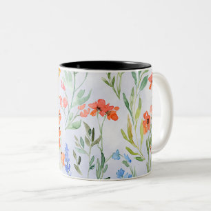 Kleurrijke lente weide met wilde bloemen tweekleurige koffiemok