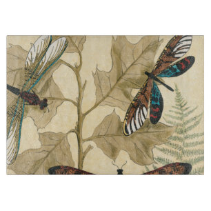 Kleurrijke libellen die boven bladeren drijven snijplank