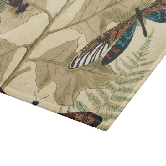 Kleurrijke libellen die boven bladeren drijven snijplank (Hoek)