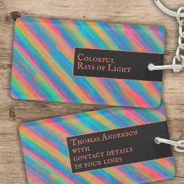 Kleurrijke lichtstralen die in duisternis vallen sleutelhanger