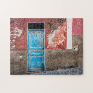 Kleurrijke muur met blauwe deur legpuzzel