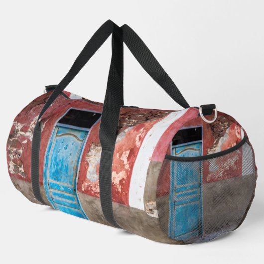 Kleurrijke muur met blauwe deur plunjezak (Rechterhoek)