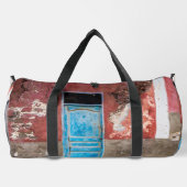 Kleurrijke muur met blauwe deur plunjezak (Achterkant)