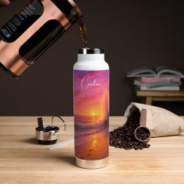 Kleurrijke oceanoceaanzon maakt een grote splash - waterfles