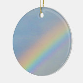 Kleurrijke regenboog in blauwe hemel, foto keramisch ornament (Links)