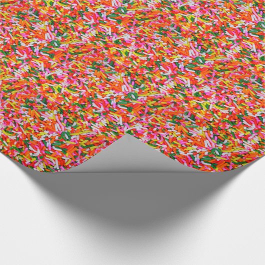 Kleurrijke regenboogspringen cadeaupapier (Hoek)