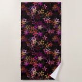 Kleurrijke sterren dansen grillig strandlaken (Voorkant)