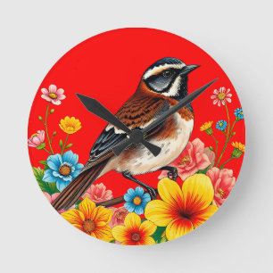 Kleurrijke vogel neergestreken tussen bloemen ronde klok