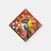 Kleurrijke vogel neergestreken tussen levendige bl servet (Hoek)