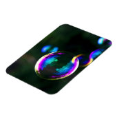 Kleurrijke zeepbellen drijven magneet (Linkerzijde)