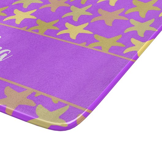 Kleurrijke zeester op paars snijplank (Hoek)