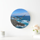 Klok rotsen in zee (Huis)