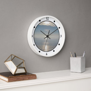 Klok - Zon reflecties op de oceaan