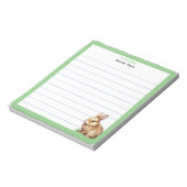 Knuffelkonijn met groene lijst notitieblok (Linkerzijde)