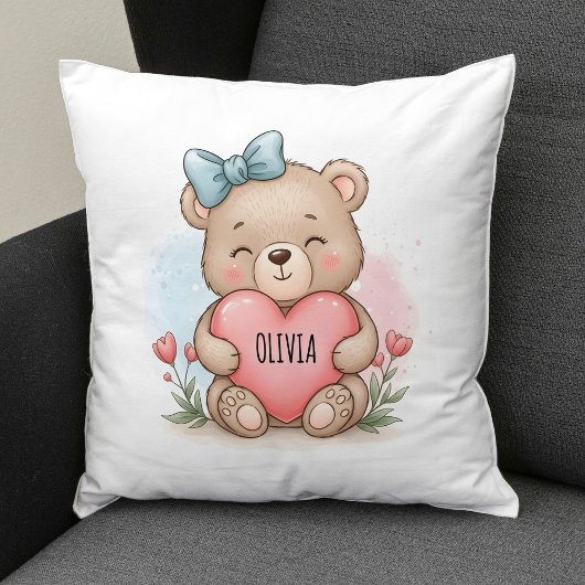 Knuffige teddybeer met roze hart kussen