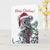 Koala in een Santa Hat Christmas Kaart (Gele Bloem)