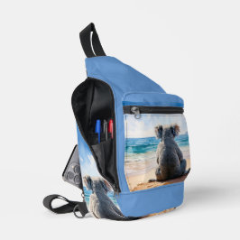 Koala kijkt naar de oceaan sling bag
