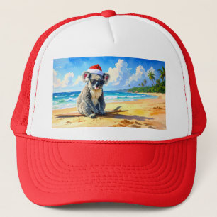 Koala met kerstmuts geniet van zon en branding trucker pet