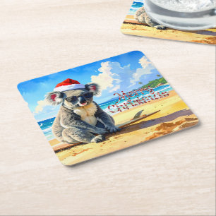 Koala met kerstmuts genietend van zon en branding kartonnen onderzetters