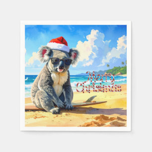 Koala met kerstmuts genietend van zon en branding servet