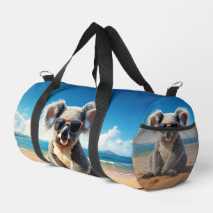 Koala op een zandstrand plunjezak