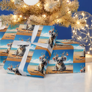 Koala op het strand met een gewei en kralen cadeaupapier