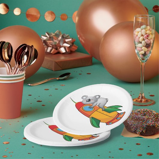 Koala slapen op kleurrijke raket papieren bordje