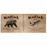Kodiak Salmon Label Fotobeeldje Magneet<br><div class="desc">Een etiket van een blik van mythisch Kodiak Brand Sockeye Salmon rond 1879. Het monochrome (bruine) afbeelding bevat een Kodiak-Beer (Ursus arctos middendorffi) en een Sockeye-zalm (Oncorhynchus nerka). Tekst voor "Kodiak Brand Sockeye Salmon" en andere informatie over de mythische Afognak Packing Company en over hoe de vis moet worden voorbereid....</div>