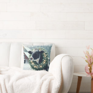 Koe met verlichte kerstkrans kussen