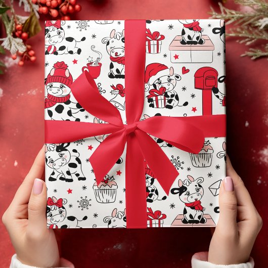 Koeien voor kerstfeestdagen bevestigen een modern  cadeaupapier
