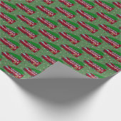 Koeksmobiel met kerstboom bovenaan cadeaupapier (Hoek)