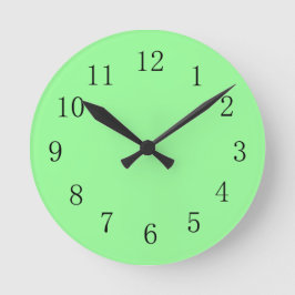 Koel met de groene kleurenwandklok ronde klok