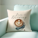 Koffie liefhebber thema liefde is het brouwen van  kussen<br><div class="desc">Voeg een gezellige touch toe aan uw huis of evenement met onze koffieliefhebber themakussen, met de charmante uitdrukking "Love is Brewing" naast prachtige geïllustreerde koffiehuiskunst. Een charmant cadeau voor koffieliefhebbers, dit kussen brengt warmte en stijl naar elke ruimte. Of het nu gebruikt wordt als een uniek geschenk of als decor...</div>