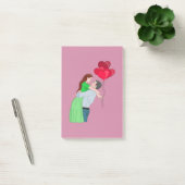 Kogeling tijdens het houden van hartritmeballonnen post-it® notes (Kantoor)