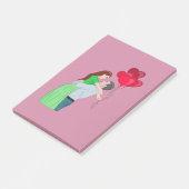 Kogeling tijdens het houden van hartritmeballonnen post-it® notes (Schuin)