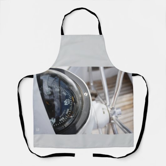 Kompas dat de richting geeft aan een avontuur.  schort (Voorkant)