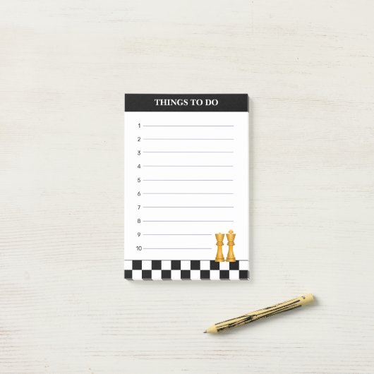 Koningin & koning op zwarte en witte schaafdingen post-it® notes (Op bureau)