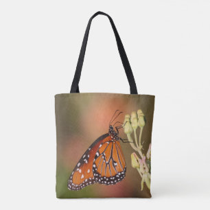 Koninginnenvlinder op een tak tote bag