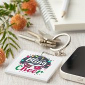 "Koop de Bling, Breng de Cheer." Sleutelhanger (Voorkant Rechts)