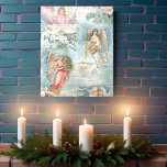 Koor van Vintage Christmas Winter Angels Schuimkern Fototegel<br><div class="desc">Een prachtige collage van mooie Victoriaans engelen,  sneeuwdepiene,  rozen,  heilige kerstmuziek,  typografie,  evergroenen en rustige landschappen op het platteland die zijn omgeven door een delicaat witte filigree op een lichthemelblauwe achtergrond.</div>
