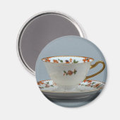 Kop en schotel met kleurrijke bloemen erop. magneet (Voorkant / Achterkant)