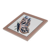 Koperkoper van keramische vlinder en zwart op staa tegeltje (Zijkant)