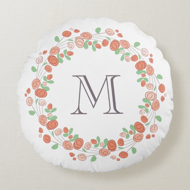 koraal roos met baarmoedermonogram rond kussen (Voorkant)