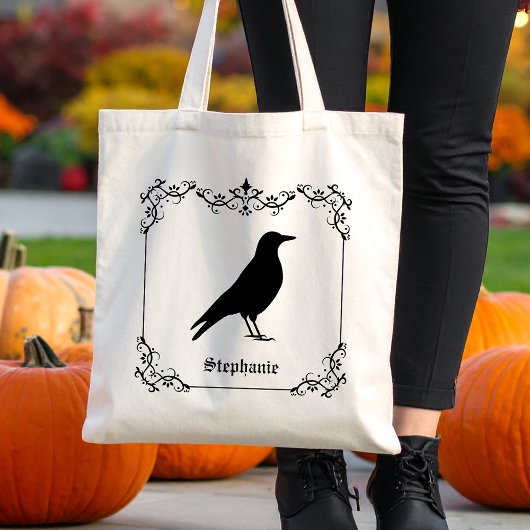 Kraaivogel silhouet en decoratieve wervelingen tote bag