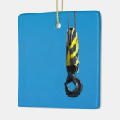 Kraanhaak met gele en zwarte strepen keramisch ornament (Links)